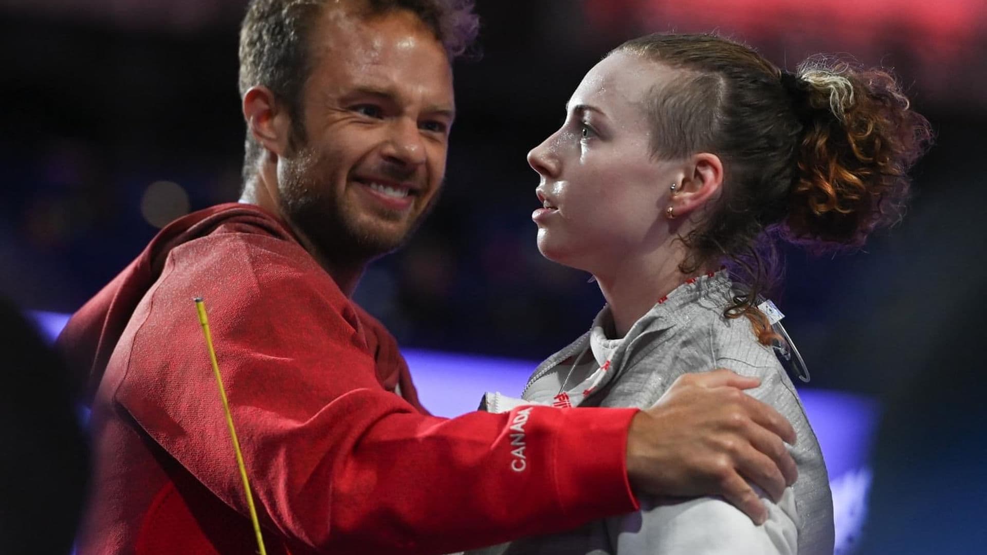 Dynamo coach celebrating with a Canadian fencer